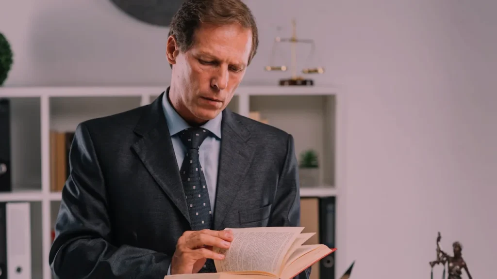 AFFF Lawsuit An attorney is depicted engrossed in reading, highlighting the relevance of AFFF firefighting foam and its connection to ongoing lawsuits.