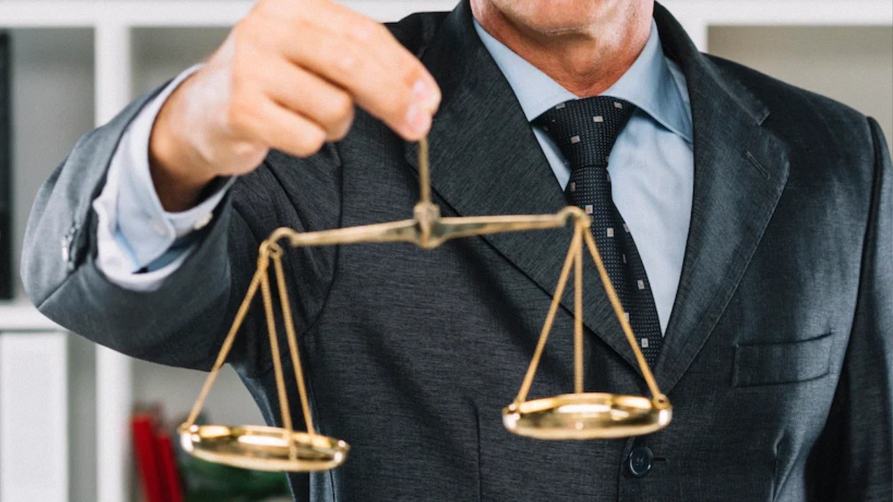 In the image, an attorney holds a golden scale that remains empty, symbolizing the equilibrium of "AFFF," "Firefighting," and "Lawsuit" elements.